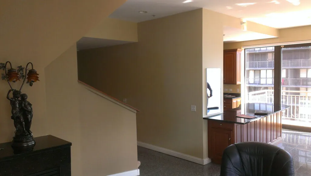 After photo of stunning modern condo kitchen renovation by Design First Builders featuring contemporary design, updated finishes, and improved layout in Illinois